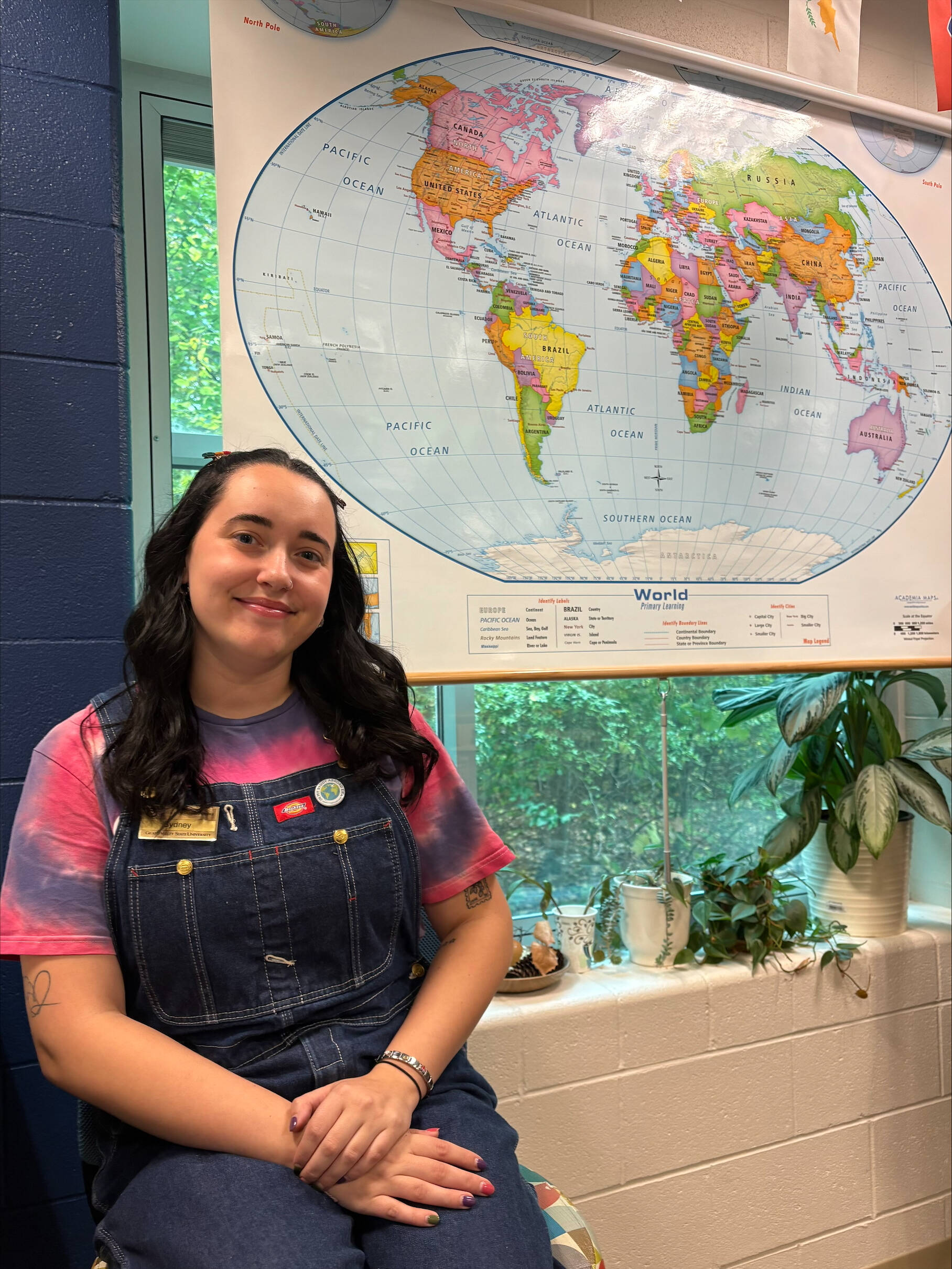 Sydney Bunk in front of world map